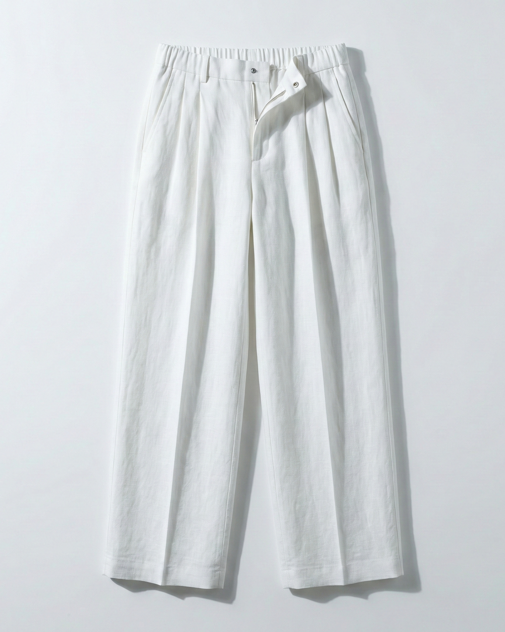 White wide-leg pants on a light gray background