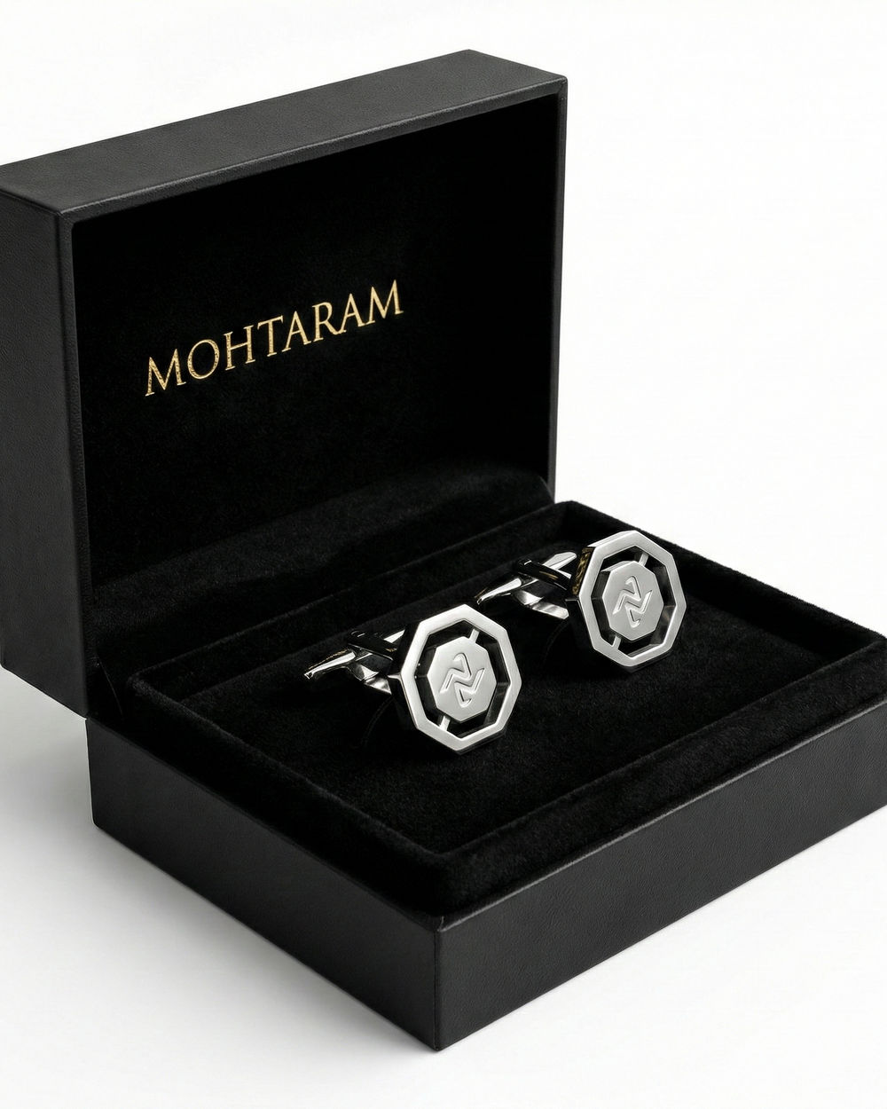Silver cufflinks with a hexagonal design and 'MOHTARAM' branding on a white background