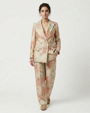 Woman wearing a floral suit on a white background