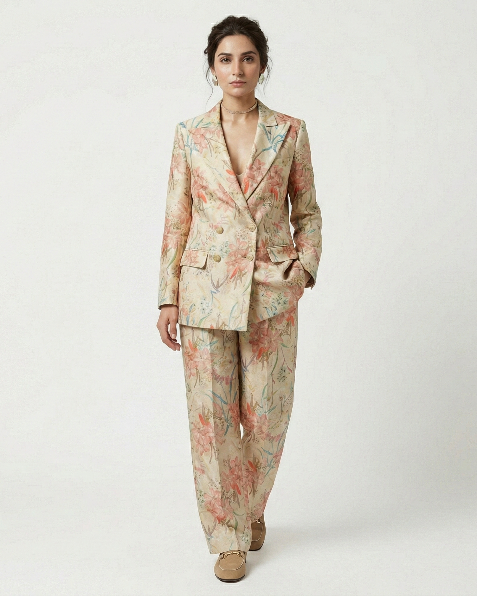 Woman wearing a floral suit on a white background