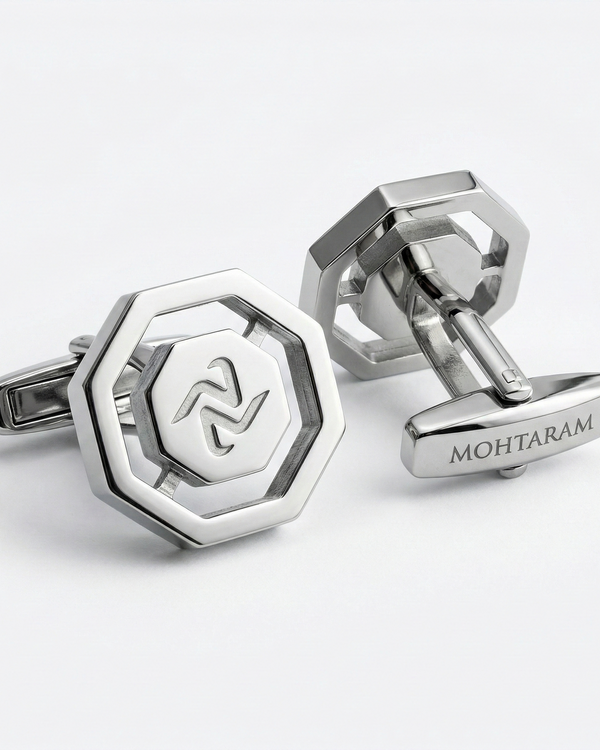 Silver cufflinks with a hexagonal design and 'MOHTARAM' branding on a white background