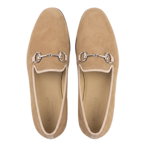 Pair of tan loafers with metallic buckles on a white background