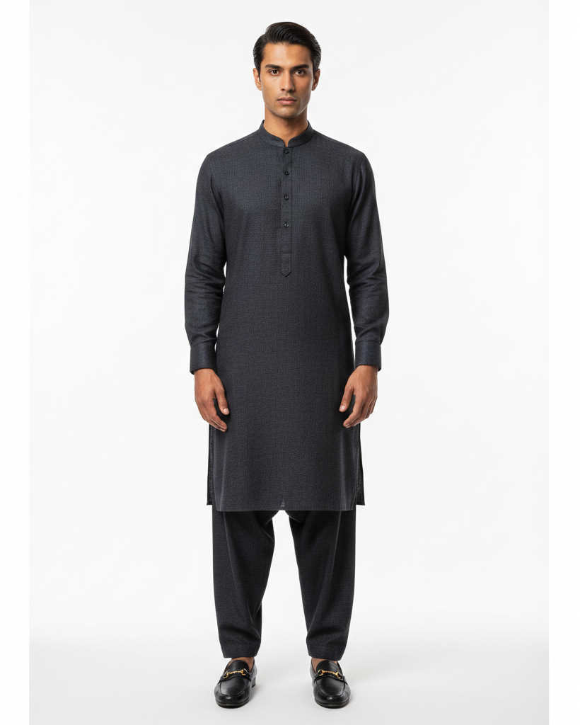 Man wearing a black kurta with pants on a white background