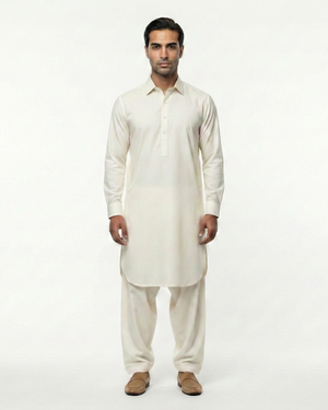 Man wearing a white kurta with pants on a white background