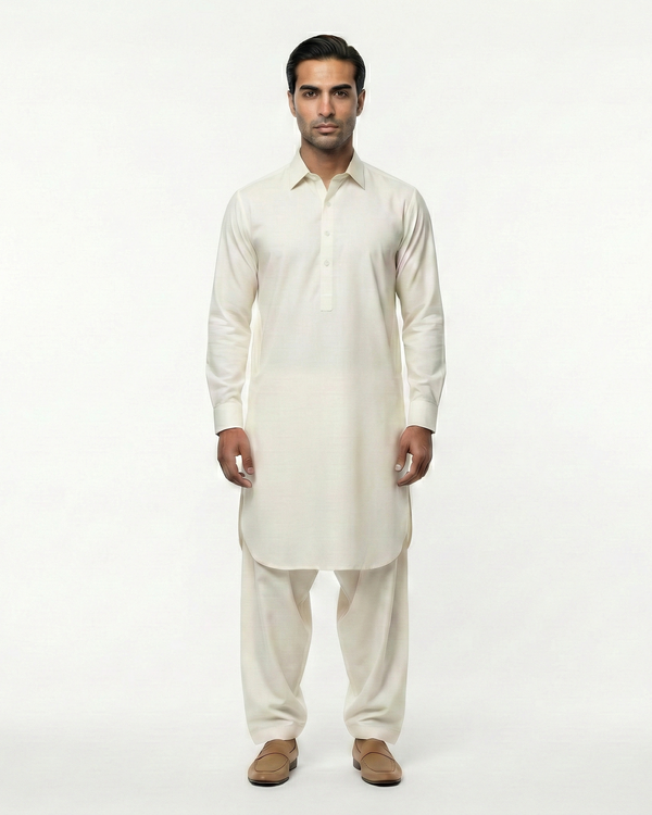Man wearing a white kurta with pants on a white background