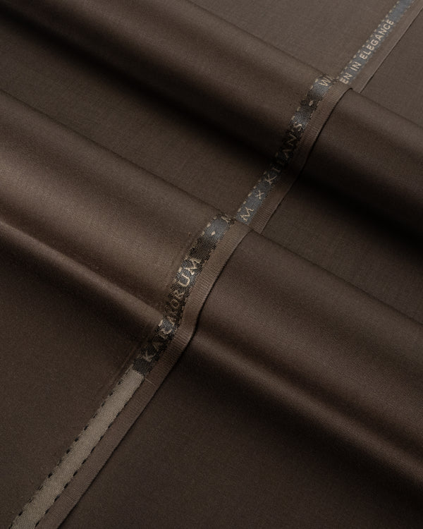 Close-up of brown fabric with a visible brand label.
