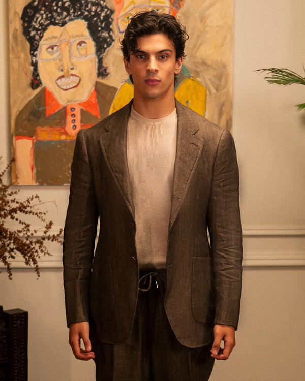 Mohtaram – Convertible brown linen jacket worn open with notch lapels over an ecru knit tee, front view