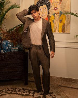 Mohtaram – Convertible suit jacket worn open with drawstring trousers