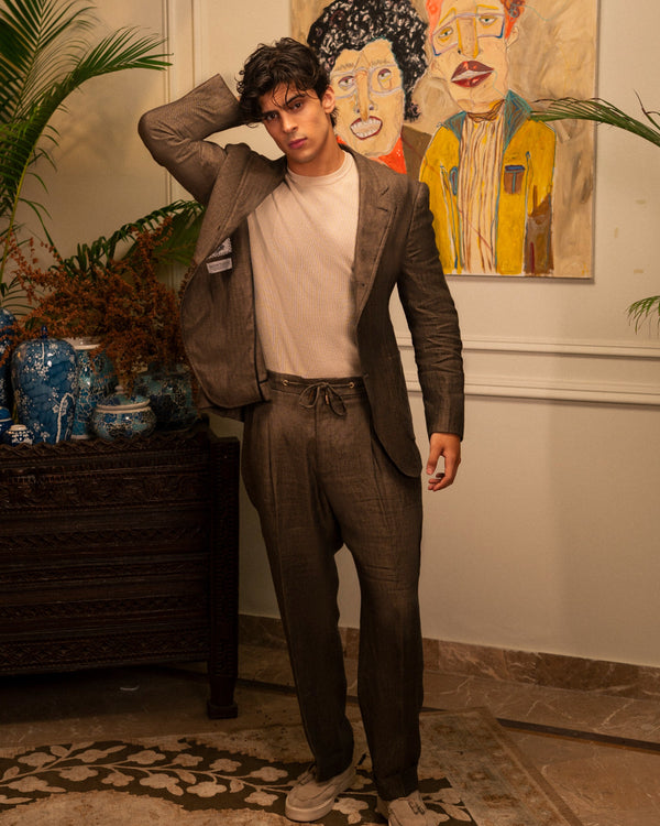 Mohtaram – Convertible suit jacket worn open with drawstring trousers