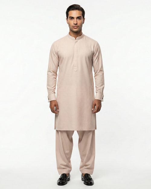 Man wearing a beige kurta set on a white background