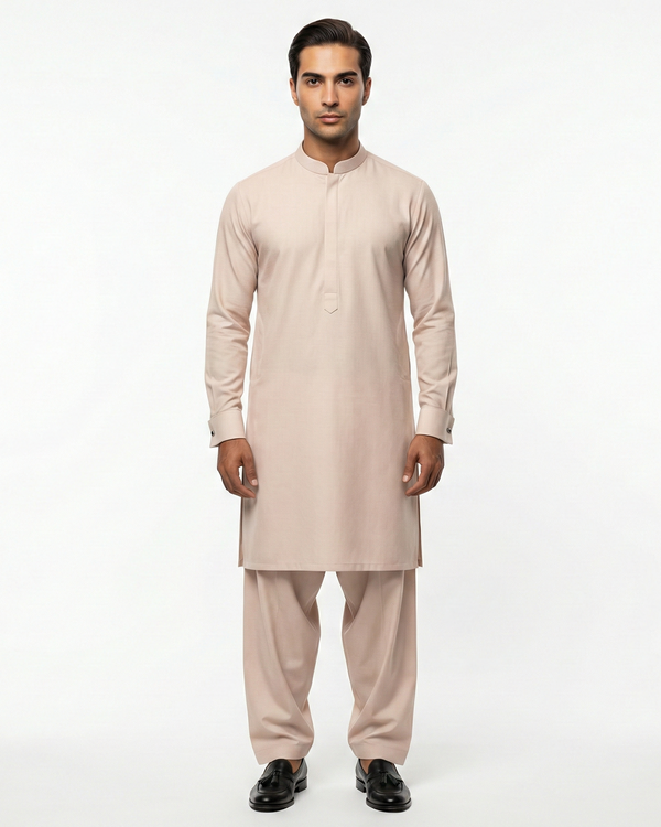 Man wearing a beige kurta set on a white background