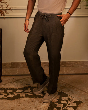 Mohtaram – Brown herringbone linen drawstring trousers with front pleats, front view