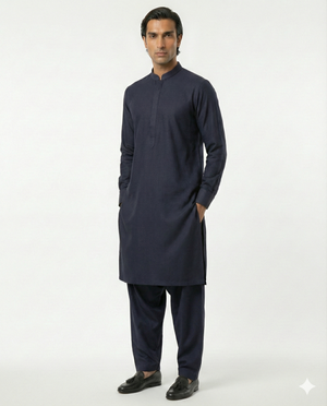 Man wearing a navy kurta with pants on a white background